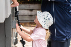 A child is about to climb up a rope