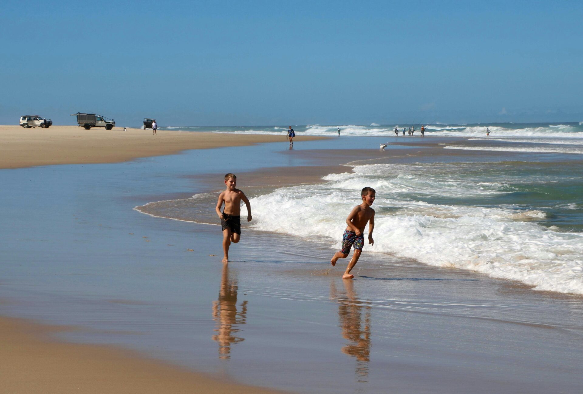 children playing on the beach